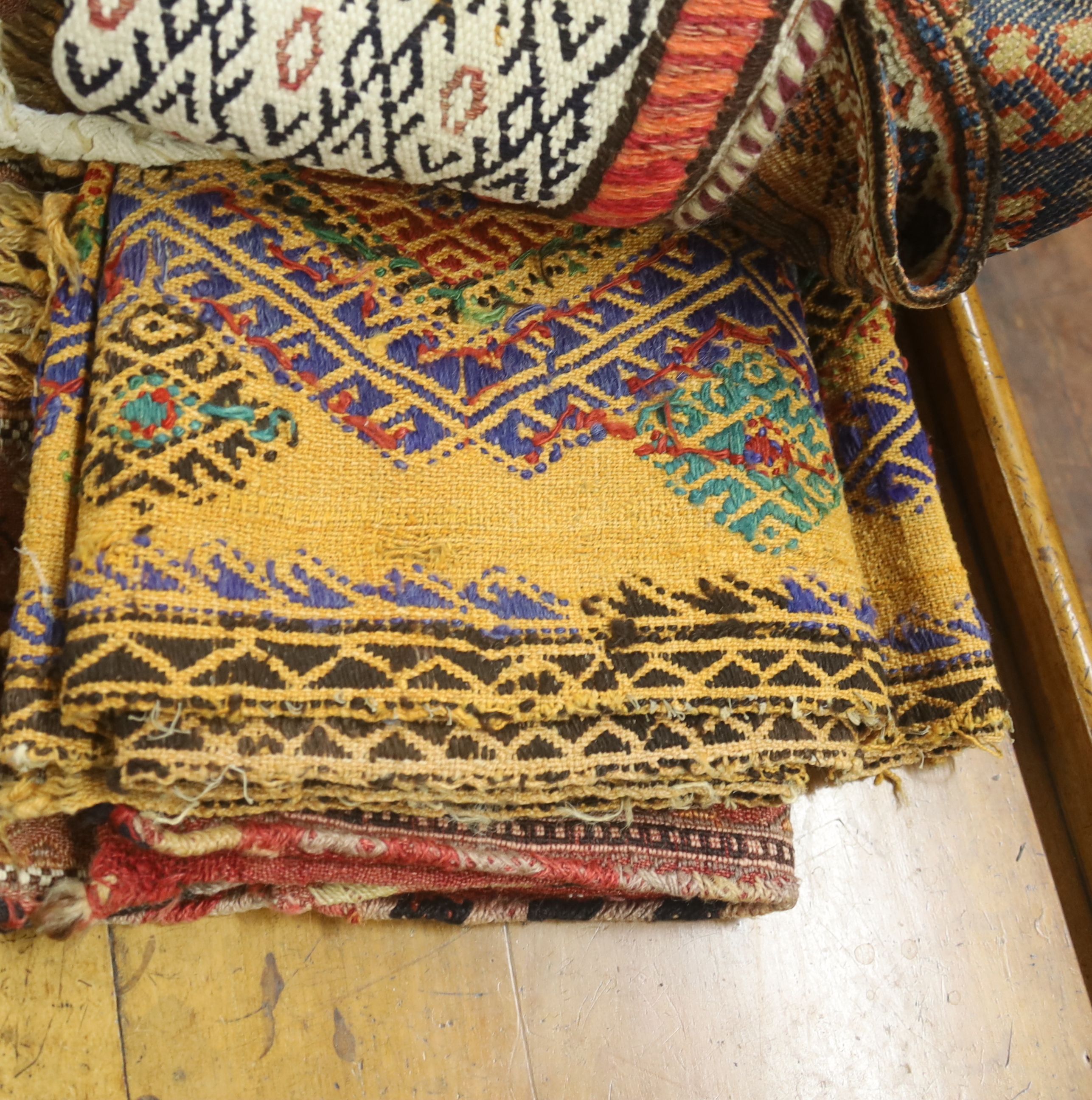 Seven Middle Eastern rugs/saddle bags